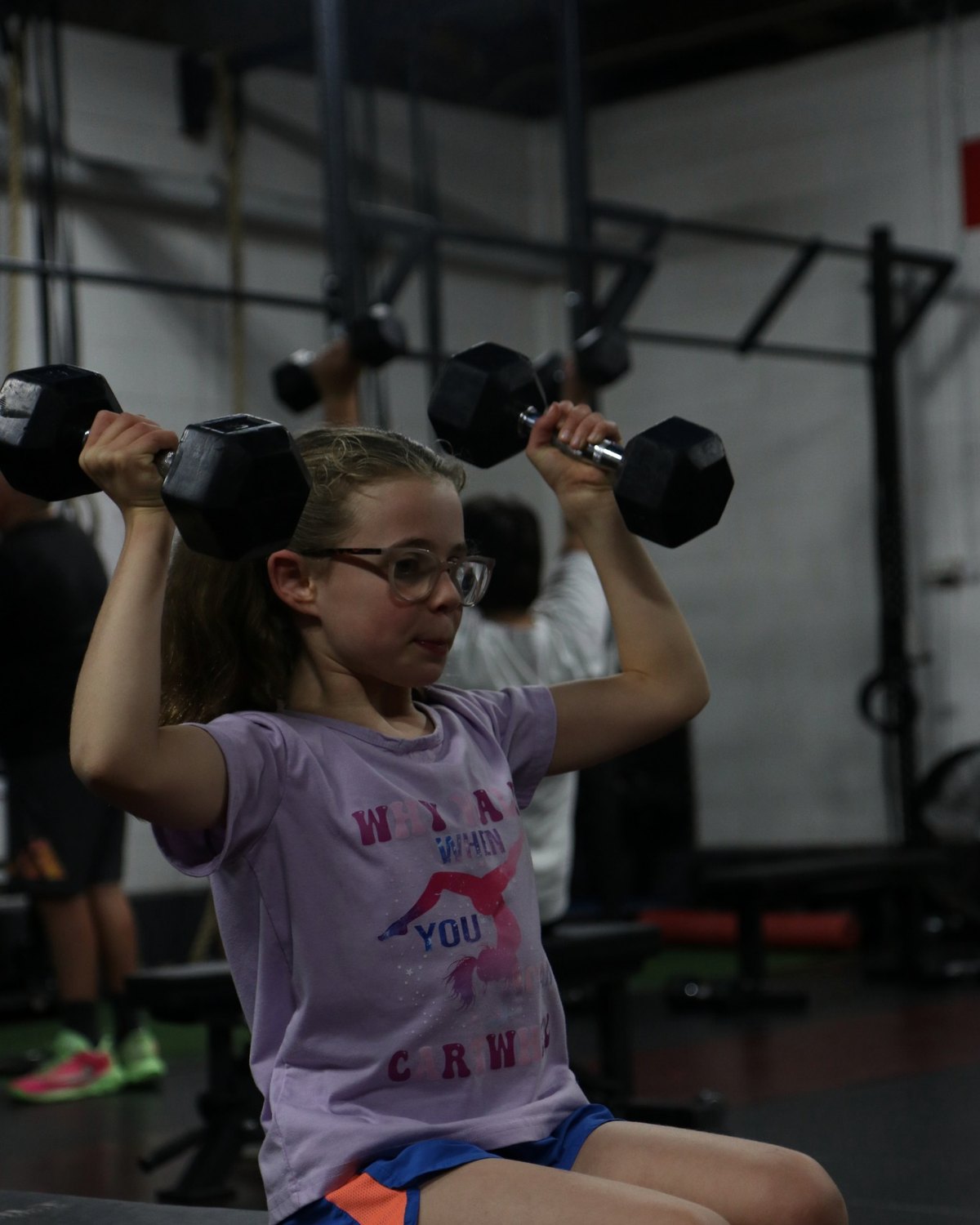 Jr.EP athlete pressing dumbbells